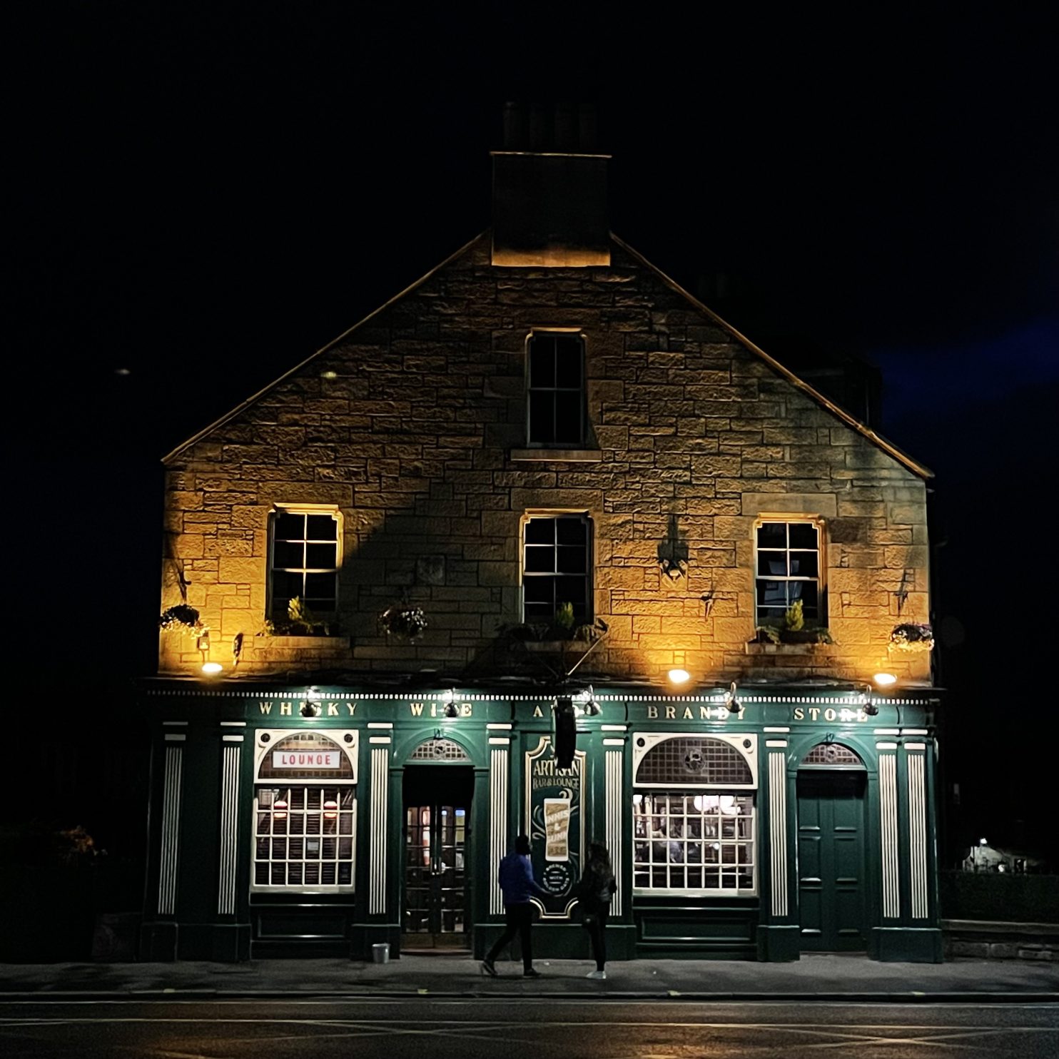 A pub lit up at night